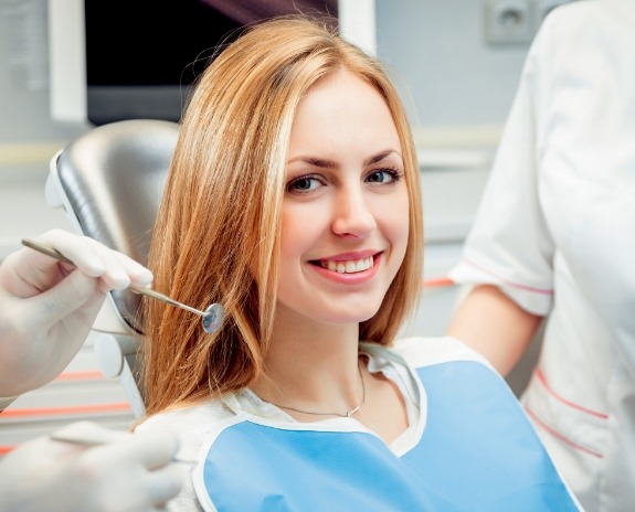 Smiling woman in dental treatment room