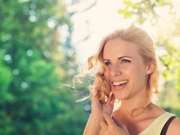 Woman with flawless smile after cosmetic dentistry