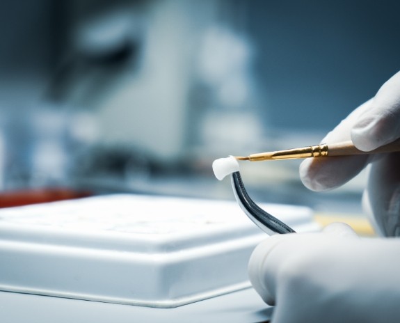 Dental lab technician crafting dental crown