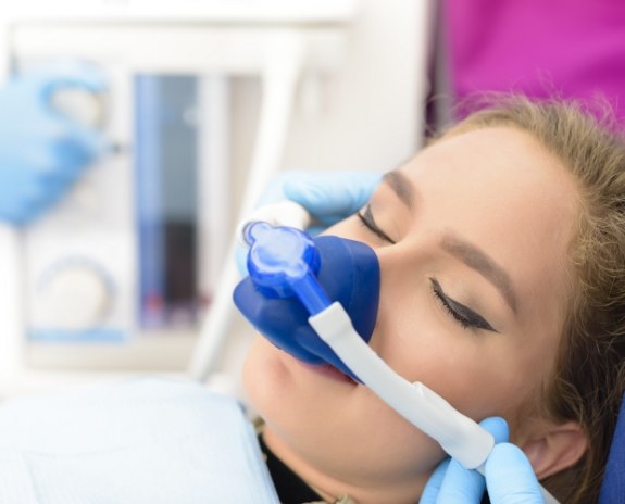 Relaxed dental patient with nitrous oxide nasal mask in place