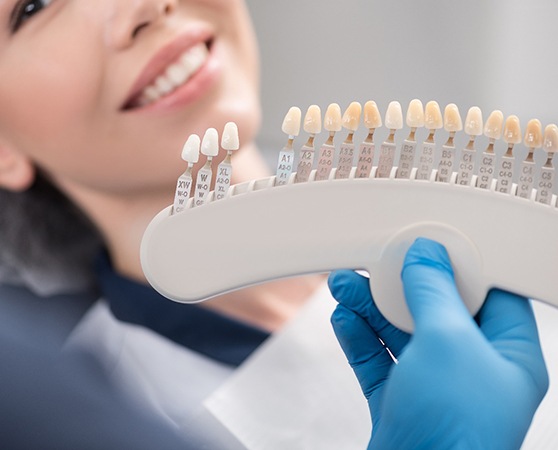 Woman smiling during veneers consultation with Cherry Hill dentist